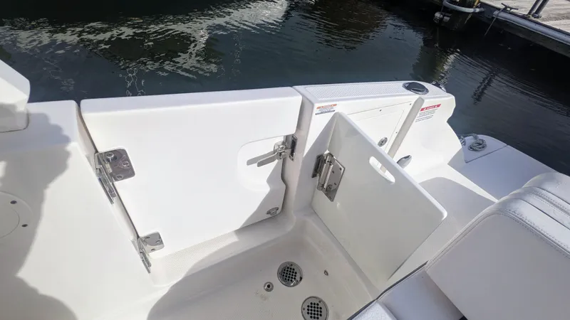  Yacht Photos Pics 2020 Chaparral 280 OSX boat deck with open hatch, near water.