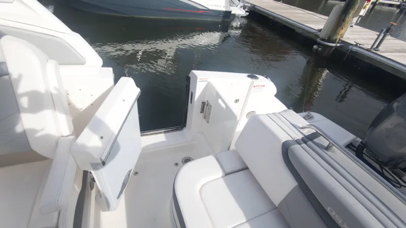 Yacht Photos Pics 2020 Chaparral 280 OSX boat interior with white seating at a marina.