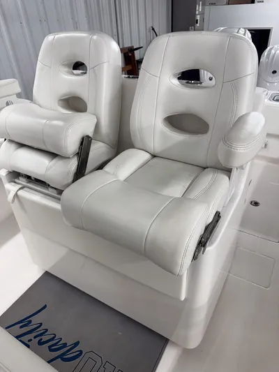  Yacht Photos Pics Luxury white seating on 2022 Contender 32 ST boat, featuring plush design and armrests.