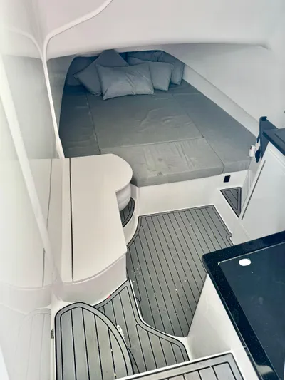  Yacht Photos Pics 2024 Contender 39 Fisharound cabin with bed and modern interior design.