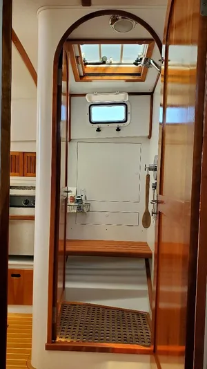 Minkie B Yacht Photos Pics Interior of 1997 Lyman-Morse Custom Flybridge yacht with wooden accents and skylight.