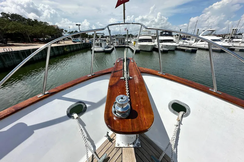 Maren Yacht Photos Pics 1980 Island Gypsy Flush Aft Deck Trawler-Motor Yacht at marina, sunny day, calm waters.