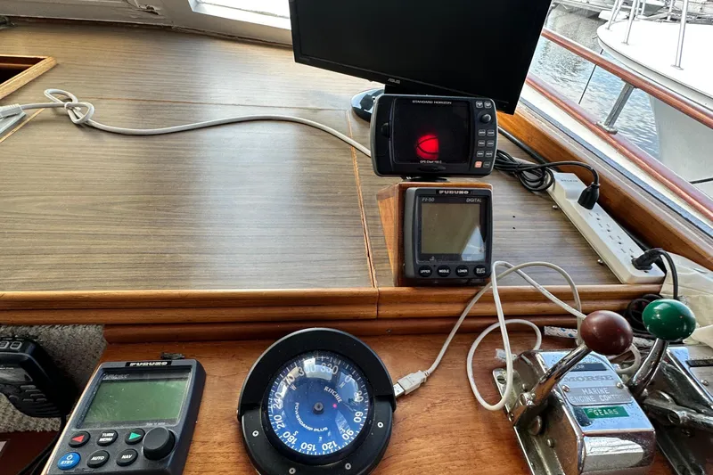 Maren Yacht Photos Pics Control panel of 1980 Island Gypsy Flush Aft Deck Trawler-Motor Yacht with navigation instruments.