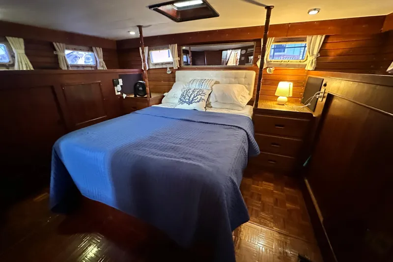 Maren Yacht Photos Pics Cozy bedroom in 1980 Island Gypsy Flush Aft Deck Trawler-Motor Yacht with wooden interior.