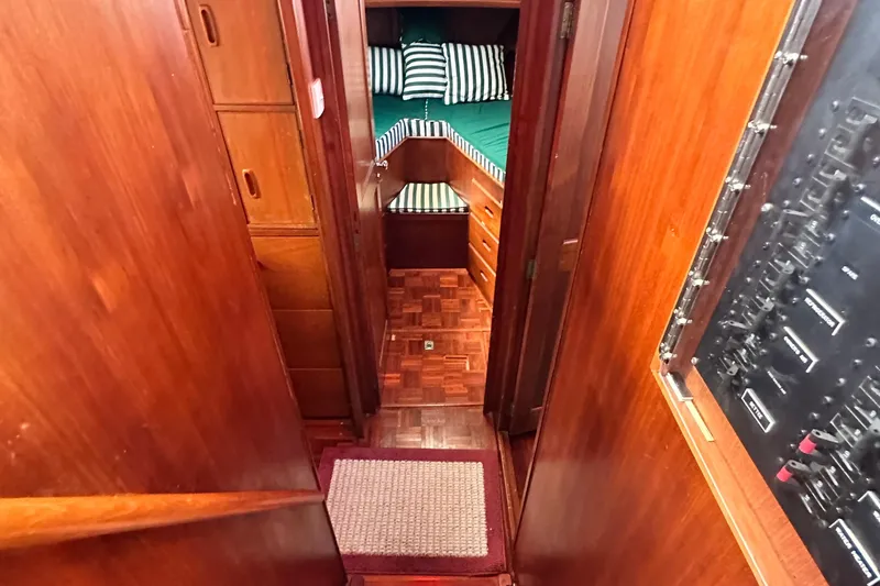 Maren Yacht Photos Pics Interior of 1980 Island Gypsy Flush Aft Deck Trawler-Motor Yacht with wood paneling and cozy cabin.