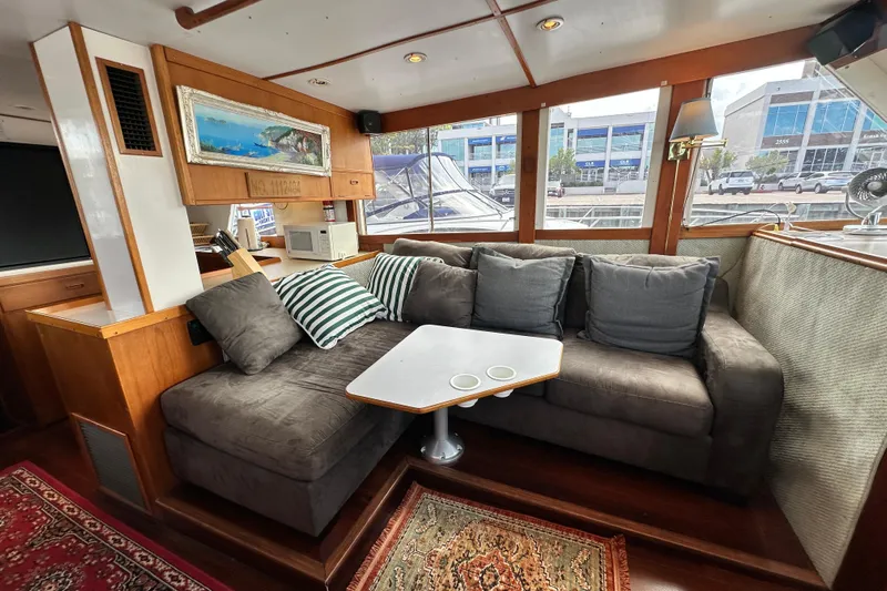 Maren Yacht Photos Pics Interior of 1980 Island Gypsy Flush Aft Deck Trawler-Motor Yacht with cozy seating area.