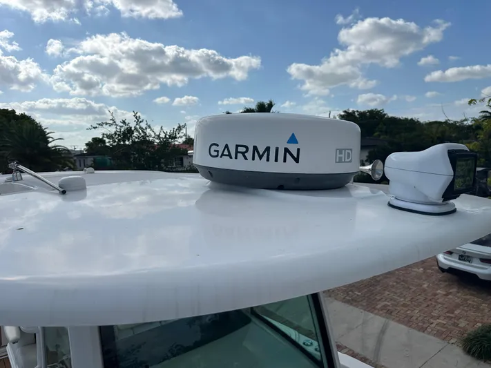  Yacht Photos Pics Garmin HD radar on 2013 Boston Whaler 320 Outrage boat under a cloudy sky.