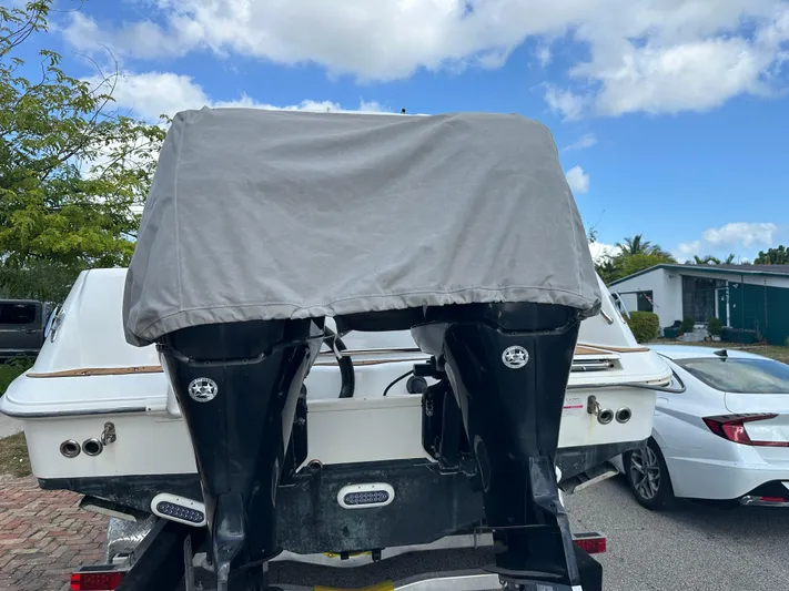  Yacht Photos Pics 2013 Boston Whaler 320 Outrage boat with covered engines, parked outdoors.