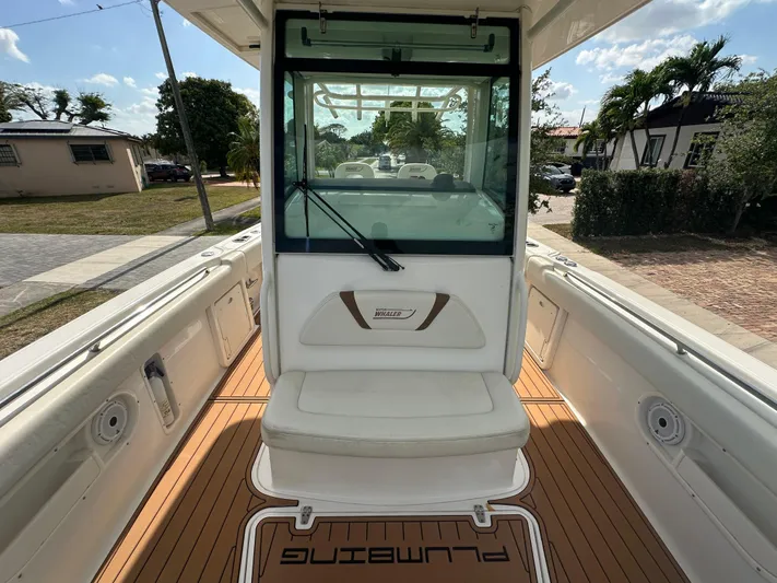  Yacht Photos Pics 2013 Boston Whaler 320 Outrage boat interior with seating and deck view.