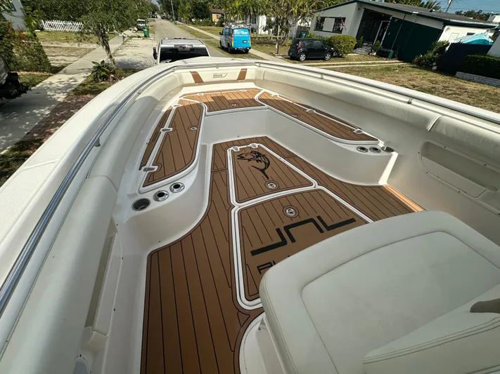  Yacht Photos Pics 2013 Boston Whaler 320 Outrage boat interior with custom deck design.