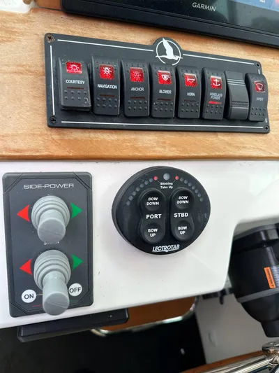 Waters Edge Yacht Photos Pics Control panel of a 2018 Back Cove Downeast 37 boat with switches and dials.
