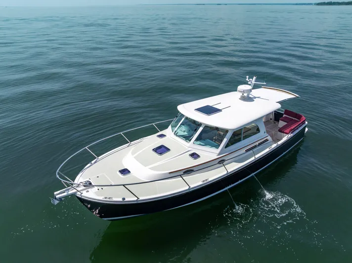 Waters Edge Yacht Photos Pics 2018 Back Cove Downeast 37 boat cruising on calm waters.