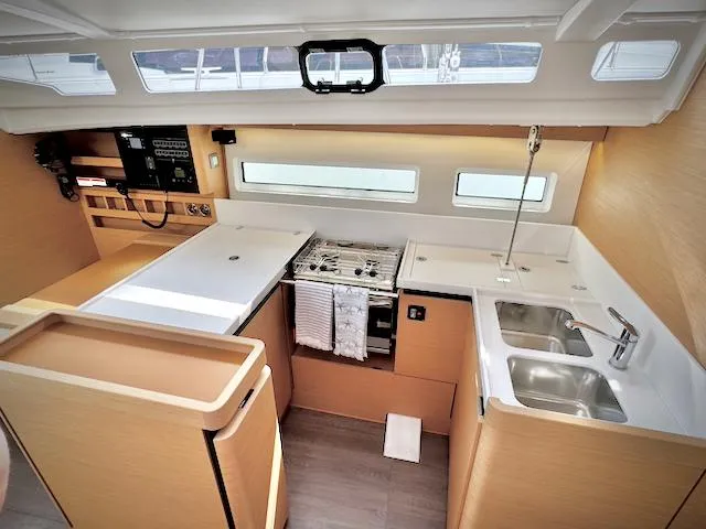 In Stock 440 #442 Yacht Photos Pics Modern kitchen in 2023 Jeanneau Sun Odyssey 440 yacht with sleek design and ample storage.