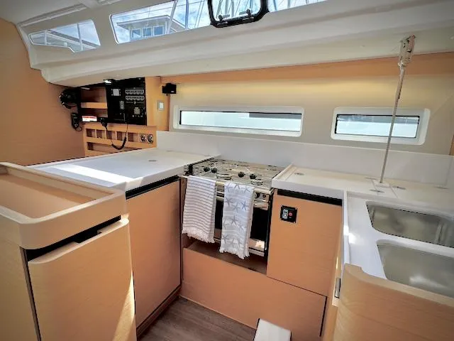 In Stock 440 #442 Yacht Photos Pics Interior of 2023 Jeanneau Sun Odyssey 440 yacht, featuring modern kitchen and sleek design.
