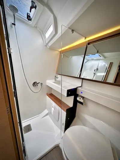 In Stock 440 #442 Yacht Photos Pics Modern bathroom in 2023 Jeanneau Sun Odyssey 440 yacht, featuring sleek design and amenities.