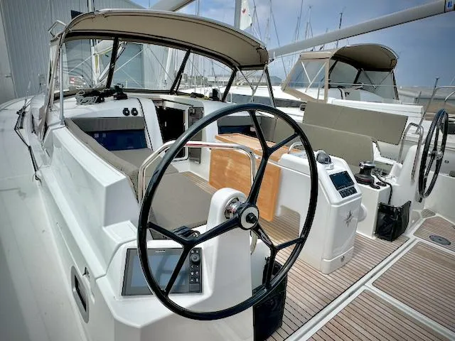 In Stock 440 #442 Yacht Photos Pics 2023 Jeanneau Sun Odyssey 440 yacht cockpit with dual steering wheels and modern navigation equipment.