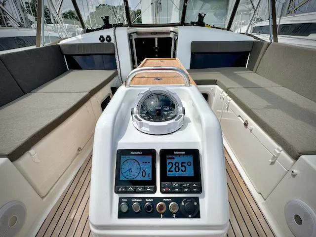 In Stock 440 #442 Yacht Photos Pics 2023 Jeanneau Sun Odyssey 440 cockpit with navigation instruments and seating.