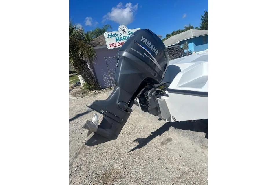 Outboard motor on a boat at Hobe Sound Marine, sunny day.