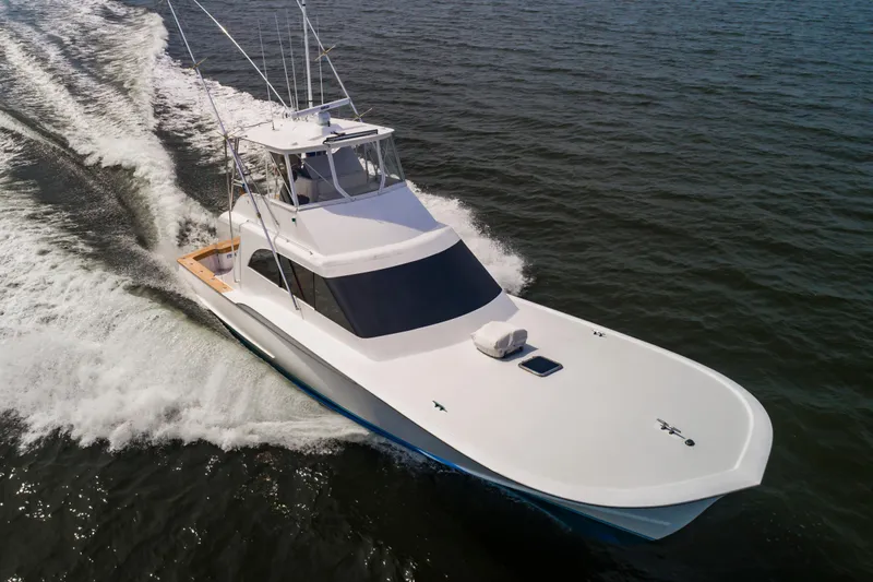 Fish Repellent Yacht Photos Pics Jarrett Bay 54 Convertible 2000 yacht cruising on open water.