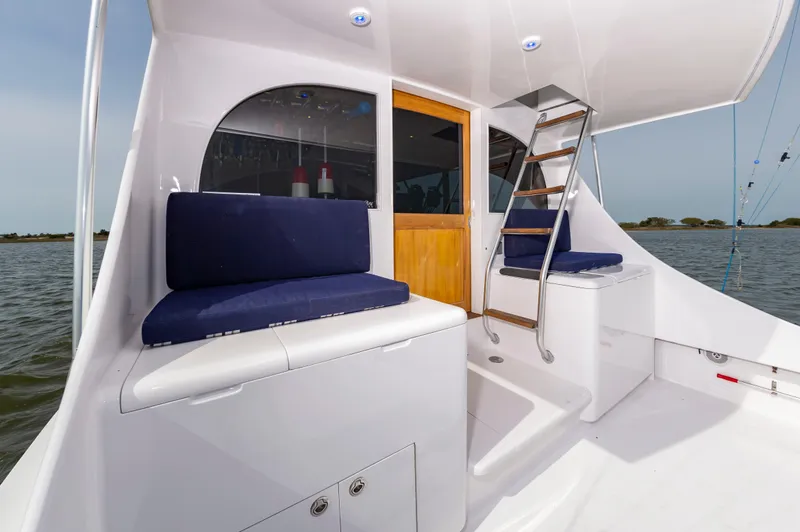 Fish Repellent Yacht Photos Pics Jarrett Bay 54 Convertible 2000 yacht interior with seating and ladder on deck.