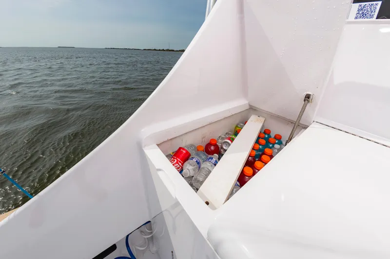 Fish Repellent Yacht Photos Pics Jarrett Bay 54 Convertible boat with cooler full of drinks, ocean view.