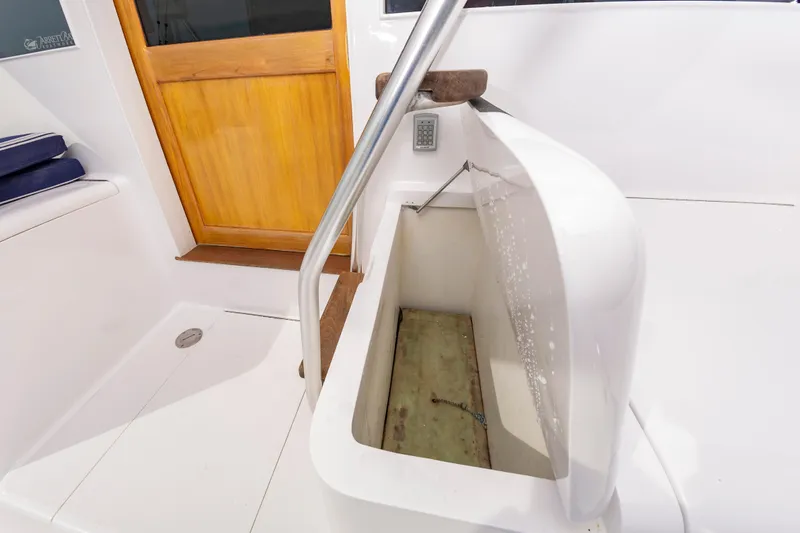 Fish Repellent Yacht Photos Pics Open hatch on 2000 Jarrett Bay 54 Convertible boat deck, near wooden door.
