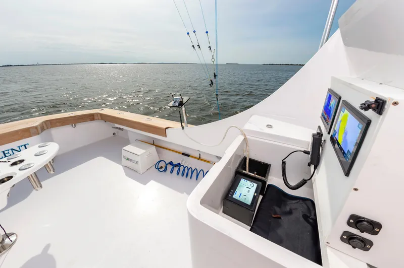 Fish Repellent Yacht Photos Pics Jarrett Bay 54 Convertible 2000 model, fishing cockpit with ocean view and navigation screens.