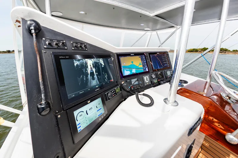 Fish Repellent Yacht Photos Pics Jarrett Bay 54 Convertible 2000 yacht helm with advanced navigation systems and controls.