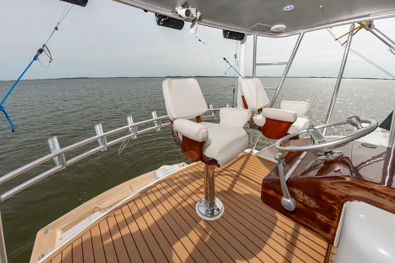 Fish Repellent Yacht Photos Pics Jarrett Bay 54 Convertible 2000 yacht helm with ocean view and luxurious seating.