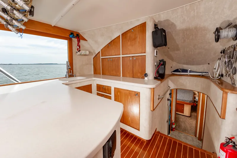 Fish Repellent Yacht Photos Pics Interior of 2000 Jarrett Bay 54 Convertible yacht with wooden cabinetry and ocean view.