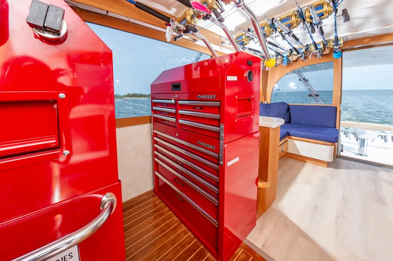 Fish Repellent Yacht Photos Pics Interior of 2000 Jarrett Bay 54 Convertible with red tool chest and ocean view.