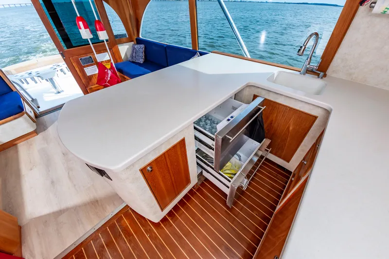 Fish Repellent Yacht Photos Pics Luxurious interior of 2000 Jarrett Bay 54 Convertible yacht with modern kitchen and ocean view.