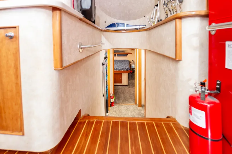 Fish Repellent Yacht Photos Pics Interior of 2000 Jarrett Bay 54 Convertible yacht, featuring wood flooring and cozy cabin.