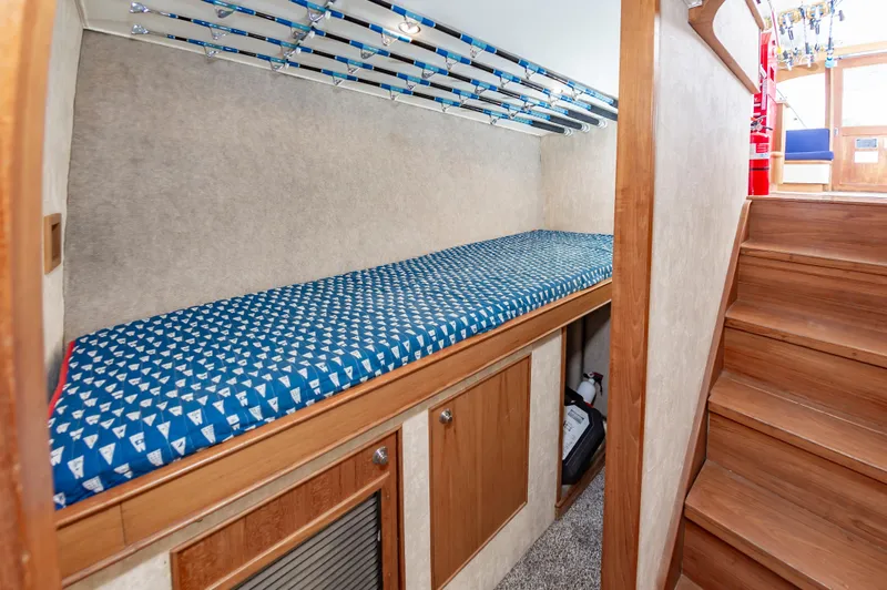Fish Repellent Yacht Photos Pics Jarrett Bay 54 Convertible 2000 interior with bunk bed and wooden stairs.