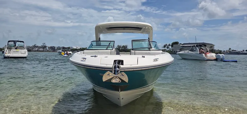  Yacht Photos Pics 2021 Sea Ray SLX 310 Outboard boat anchored in clear water, sunny day.