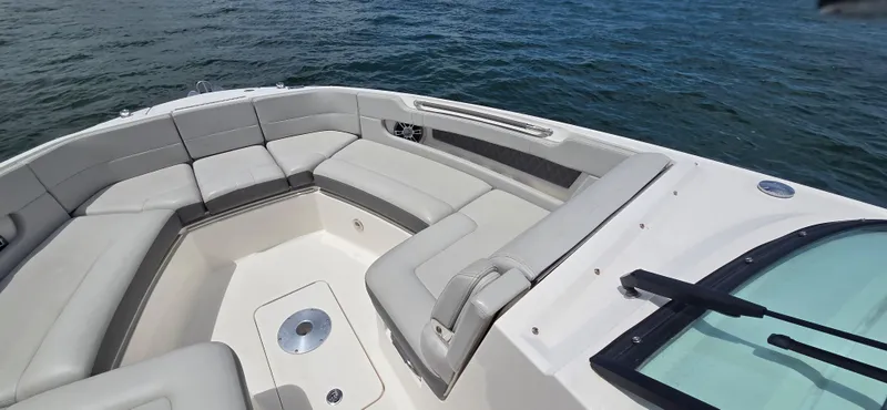  Yacht Photos Pics 2021 Sea Ray SLX 310 Outboard boat with spacious seating on calm water.