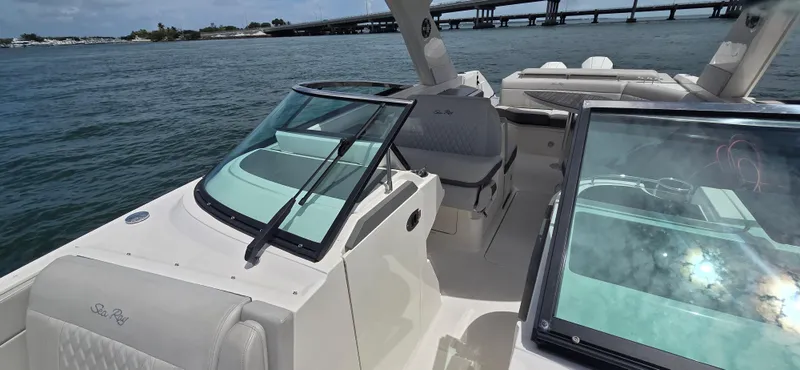  Yacht Photos Pics 2021 Sea Ray SLX 310 Outboard boat on water, featuring spacious seating and sleek design.