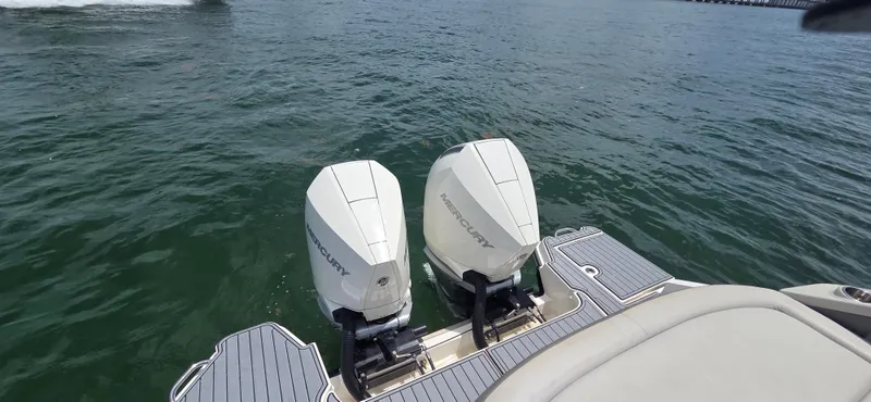  Yacht Photos Pics 2021 Sea Ray SLX 310 Outboard with twin Mercury engines on open water.