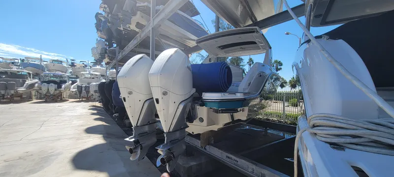  Yacht Photos Pics 2021 Sea Ray SLX 310 Outboard boats in storage, featuring dual engines and sleek design.
