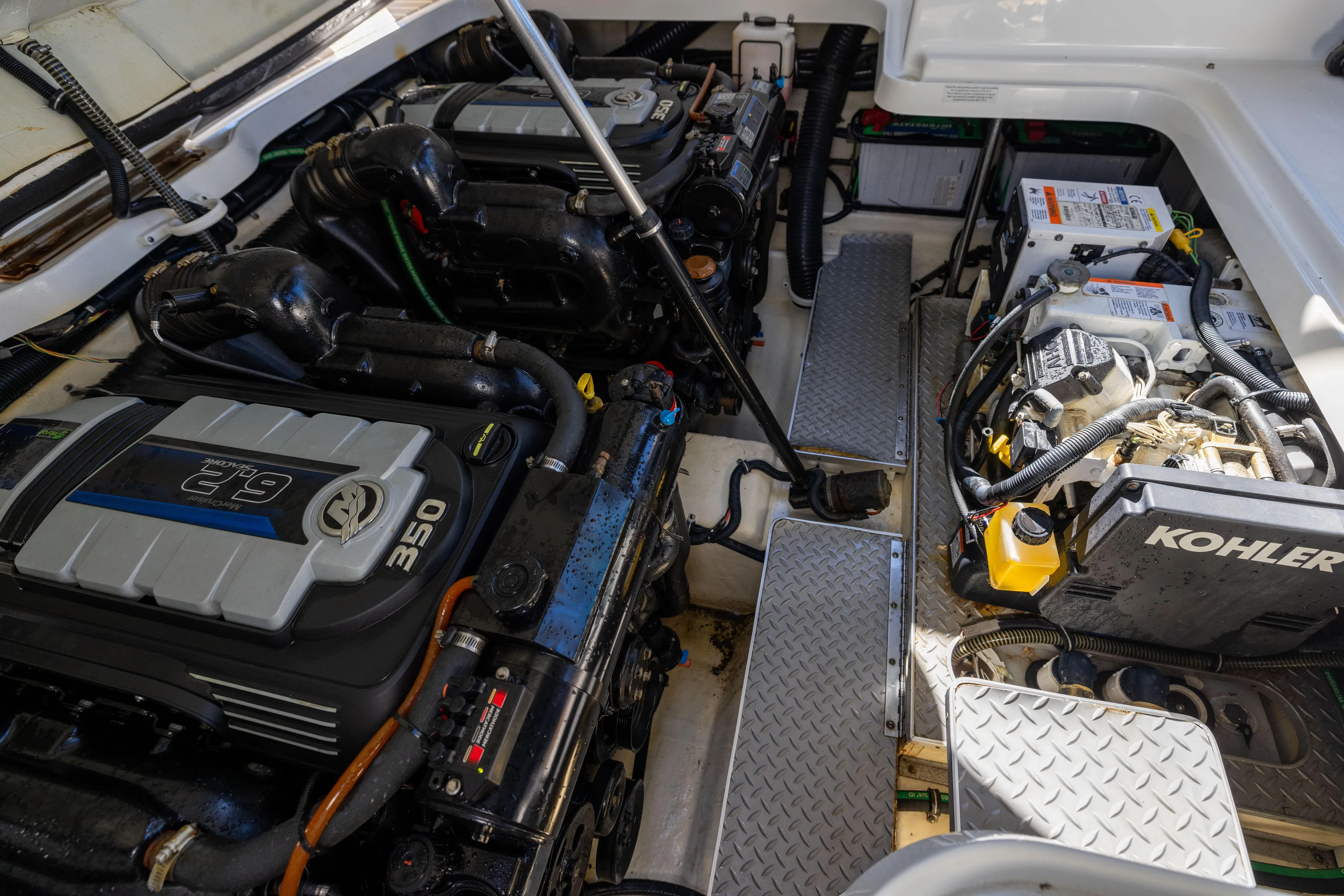 This Is It Yacht Photos Pics Engine compartment of 2017 Formula 330 Crossover Bowrider with dual engines and Kohler generator.