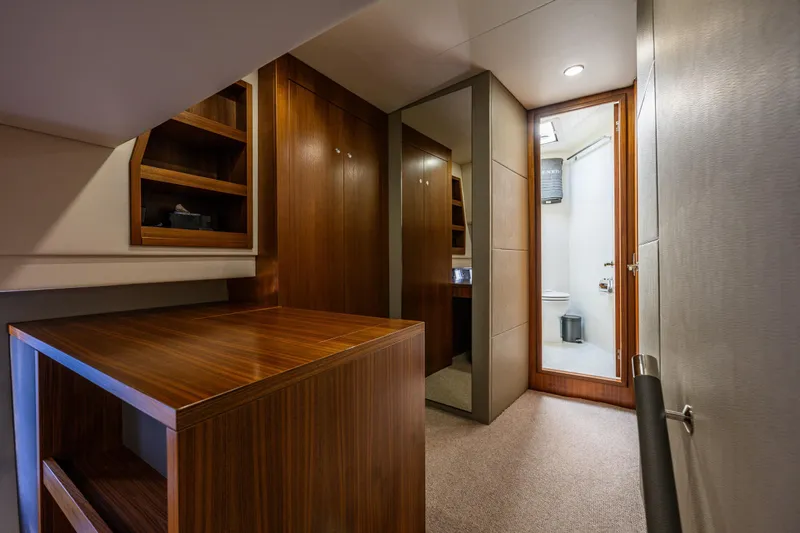 True North Yacht Photos Pics Luxurious interior of 2020 Maritimo M59 yacht featuring wood cabinetry and modern bathroom.