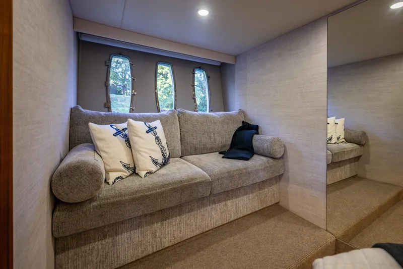 True North Yacht Photos Pics Luxurious interior of 2020 Maritimo M59 yacht with cozy sofa and nautical decor.