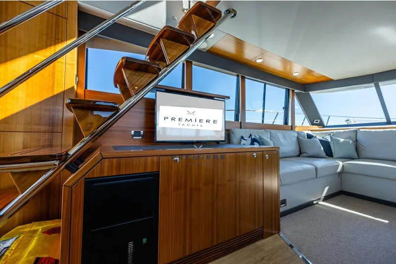 True North Yacht Photos Pics Luxurious interior of 2020 Maritimo M59 yacht with elegant wood finishes and comfortable seating.