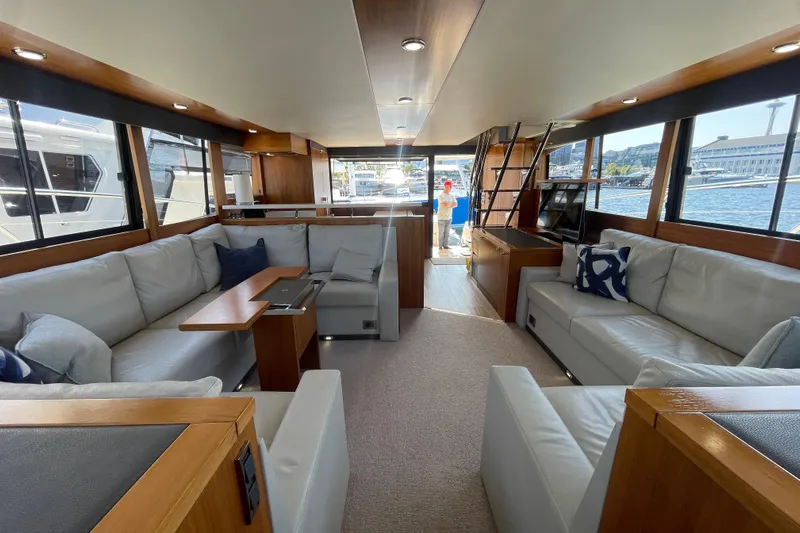 True North Yacht Photos Pics Luxurious interior of 2020 Maritimo M59 yacht with spacious seating and modern design.
