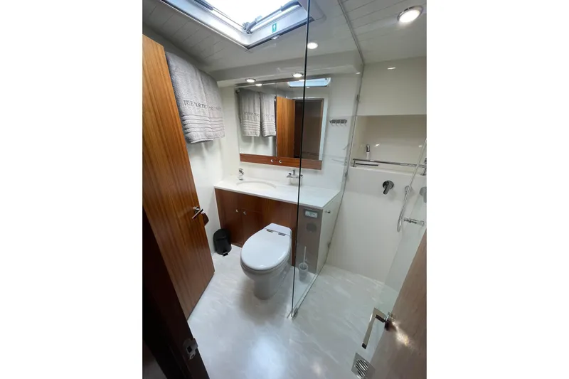 True North Yacht Photos Pics Luxurious bathroom in 2020 Maritimo M59 yacht with modern fixtures and wooden accents.
