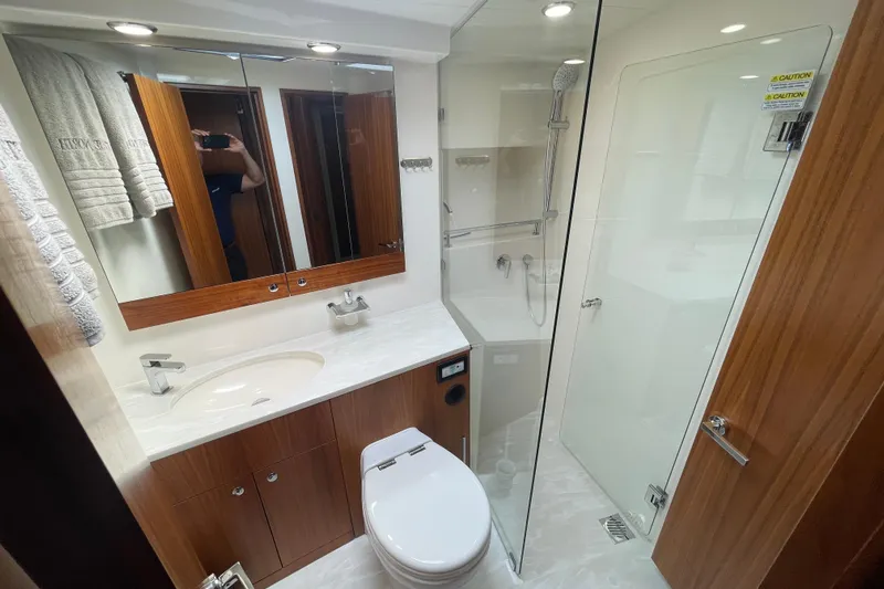 True North Yacht Photos Pics Luxurious bathroom in 2020 Maritimo M59 yacht with modern fixtures and glass shower.