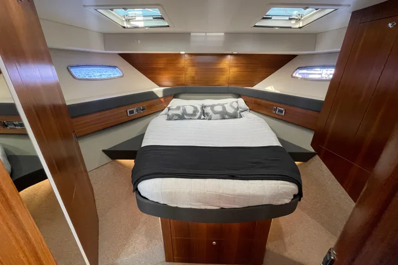 True North Yacht Photos Pics Luxurious 2020 Maritimo M59 yacht bedroom with modern design and elegant wood finishes.