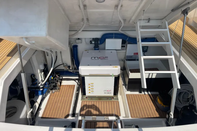 True North Yacht Photos Pics Engine room of 2020 Maritimo M59 yacht with advanced equipment and wooden flooring.