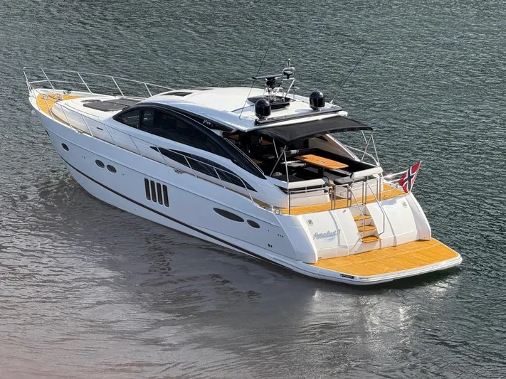  Yacht Photos Pics 2009 Princess V65 yacht on water, featuring sleek design and spacious deck.