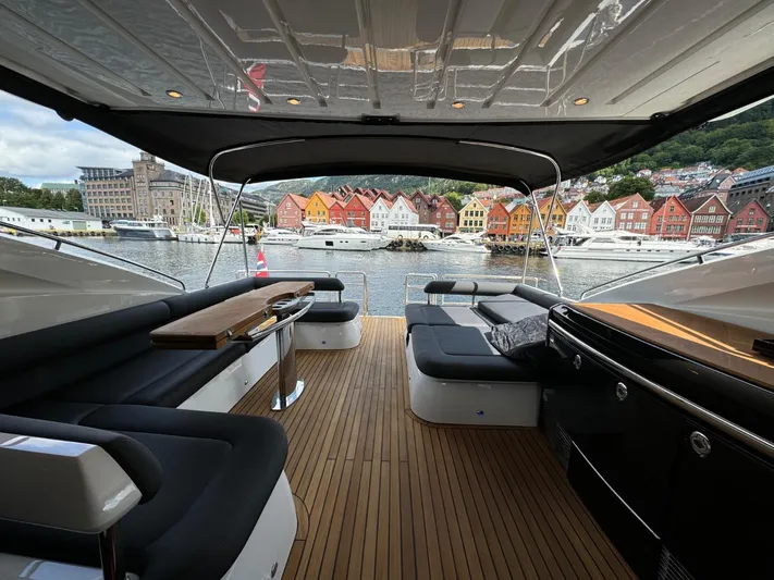  Yacht Photos Pics Luxurious 2009 Princess V65 yacht interior with scenic waterfront view and colorful buildings.